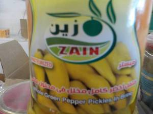 lot 234 image: 24 jars Zain Whole Green Peppers Pi...