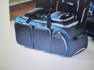 lot 74 image: Multi Pocket Upright Duffel by Trav...