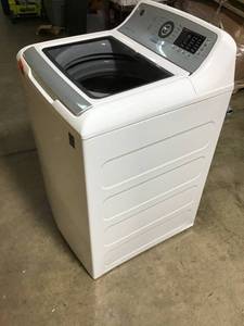 lot 38 image: GE 4.8 cu. ft. High Efficiency White Top Load Washing Machine with Tide PODs Dispenser, ENERGY STAR custumer returns