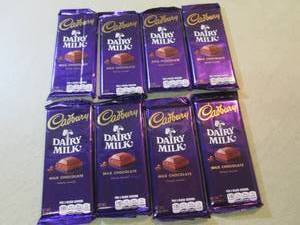 lot 239 image: 8 Cadbury Dairy Milk Chocolate Bars...