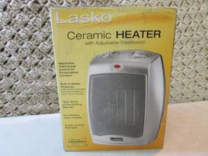 lot 82 image: Lasko 1500-Watt Electric Portable C...