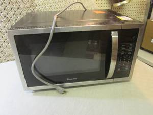 lot 96 image: Magic Chef Microwave Powers On  F-1...
