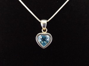 lot 7 image: .925 Sterling Silver Topaz Heart Cut Pendant Necklace