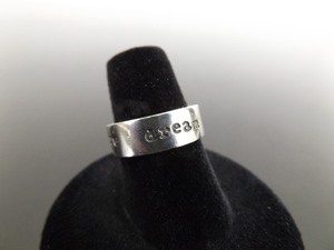 lot 74 image: .925 Sterling Silver Discover, Explore, Dream Band Ring Size 6.25