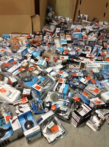 lot 139 image: Lot with assorted Moen Bathroom Accessories, shower heads and more open boxes some maybe missing parts
