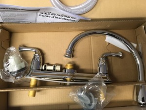 lot 11 image: MOEN Banbury 2-Handle Mid-Arc Standard Kitchen Faucet with Side Sprayer in Chrome