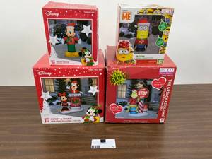lot 12 image: Lot of 4 Christmas inflatable characters - Mickey, Minnie, Kevin and The Grinch