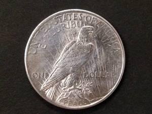 lot 82 image: 1925 AU Peace Silver Dollar...