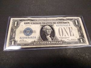lot 195 image: 1928 Funny Back One Dollar Silver C...