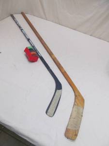 lot 81 image: hockey sticks, practice pucks
