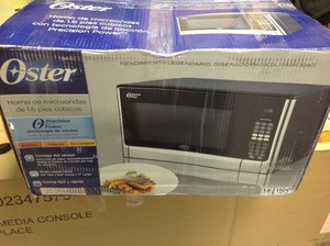 Oster 1.6 cu. ft. 1100-Watt Countertop Microwave with Inverter Sensor Cook Technology in Stainless Steel Not used