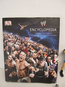 lot 285 image: Group of Assorted Wrestling figures & Hardcover Books