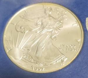 lot 21 image: 1997 AMERICAN SILVER EAGLE 1 TROY OZ. .999 FINE SILVER DOLLAR