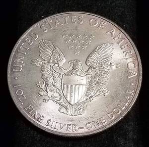 lot 25 image: 1 TROY OZ. .999 FINE SILVER OMAHA BEACH MEMORIAL SILVER EAGLE