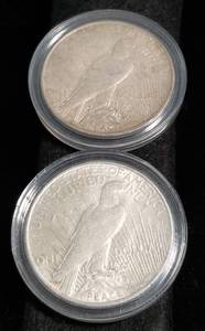 lot 37 image: 2 PEACE SILVER DOLLARS IN AIRTITES 1922 1923-D