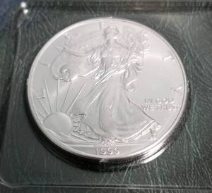 lot 53 image: 1999 AMERICAN SILVER EAGLE 1 TROY OZ. .999 FINE SILVER DOLLAR