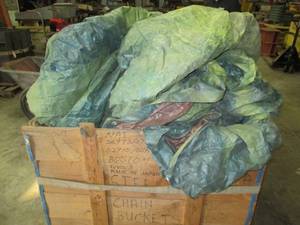 Wood crate filled with tarps and co...