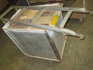 Metal cart on wheels and paint pot...