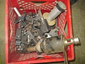 Red crate with assorted clamps...