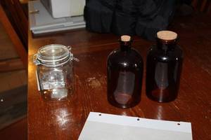 lot 159 image: Lot of (3) Flip-Top Glass Jar, 2-Brown Jugs with Cork Tops