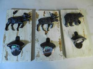 lot 92 image: 3 Cabin Theme Bottle Openers