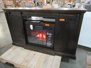 lot 267 image: Home Decorators Collection Chastain 62 X 16 12 X 36 Tall, Freestanding Media Console Electric Fireplace TV Stand with Sliding Bar Doors in Rustic Walnut - Needs Restore and Insert works but does not blow warm air