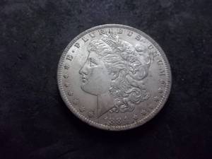 lot 18 image: 1884 O Morgan Silver Dollar