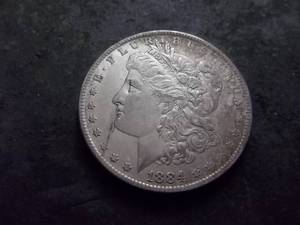 lot 19 image: 1884 O Morgan Silver Dollar