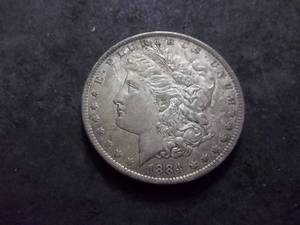 lot 20 image: 1884 O Morgan Silver Dollar