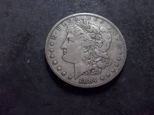 lot 21 image: 1884 O Morgan Silver Dollar