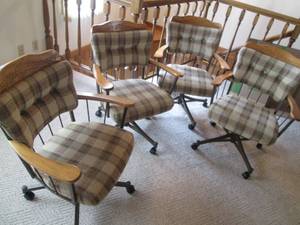 4 Padded Metal Framed Chairs on Whe...