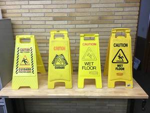 lot 55 image: Lot Of 4 Caution Wet Floor Signs