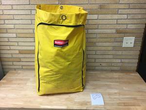 lot 65 image: RubberMaid Yellow Vinal Bag With all towelsrags inside.