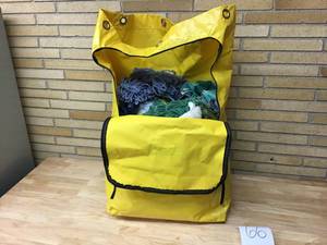 lot 66 image: RubberMaid Yellow Vinal Bag With all towelsmop heads inside