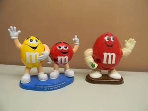 lot 44 image: M&Ms RED AND YELLOW CANDY DOUBLE DISPENSER MELTS IN YOUR MOUTH NOT IN YOUR HANDS  & BIG RED DISPENSER - BOTH NICE - SEE PICTURES