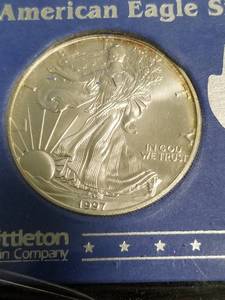 lot 52 image: 1997 AMERICAN SILVER EAGLE 1 TROY OZ. .999 FINE SILVER DOLLAR