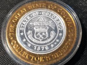 lot 91 image: SILVER CASINO TOKEN COLORADO BLUE COLUMBINE .6 OR 35 TROY OZ .999 FINE SILVER