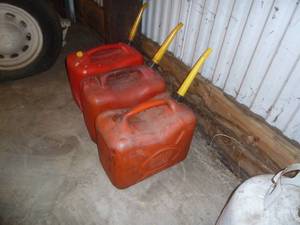 lot 30 image: Red Plastic Gas Cans