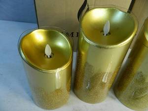 lot 13 image: 4 Genuine Luminara Pillar Candles with 2 Remotes