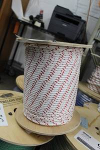 lot 41 image: New England Ropes 14in. Sta-Set X Red Fleck Rope 600 Foot Reel