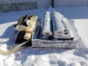 lot 15 image: 13 Plus Bundles of Timberline Shingles and 2 Plus Rolls of Tar Paper