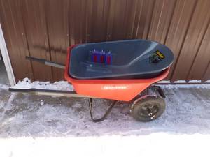 Wheel barrow with dual wheels. Poly tub is cracked. Steel tub included. As shown.