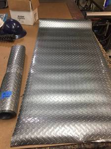 lot 17 image: Diamond Plate vinyl  plastic rolls, wrench organizers