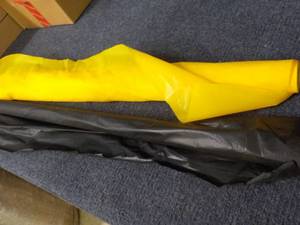 lot 273 image: Black and Yellow Plastic Material...