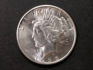 lot 80 image: 1925 AU Peace Silver Dollar...