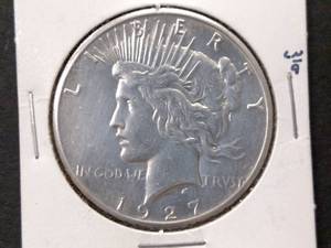 lot 87 image: 1927 Peace Silver Dollar...
