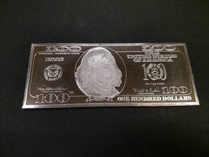 lot 146 image: 4 Ounce Silver Bar, 1998 $100 Feder...