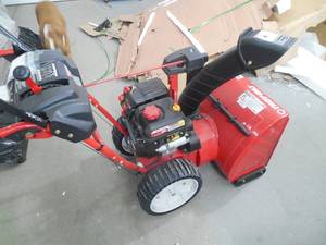lot 50 image: Troy- Built 24 in. 208cc Two-Stage Electric Start Gas Snow Blower with Airless Tires