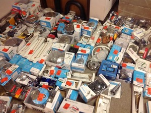 Lot with assorted Moen Bathroom Accessories, shower heads and more open boxes some maybe missing parts