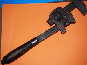 lot 10 image: antique wooden handle pipe wrench
